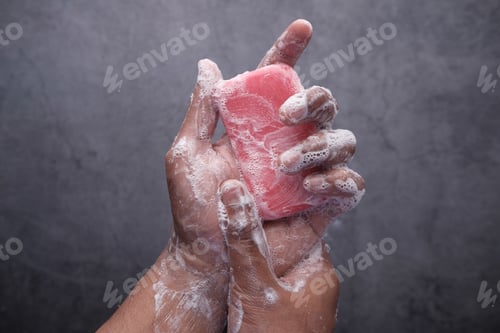 Preview: young man washing hand with soap, Top view