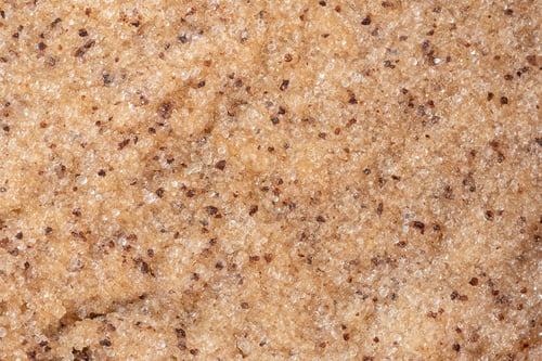 Preview: coffee scrub background. Texture cosmetic gel scrub for face and body. Selective focus