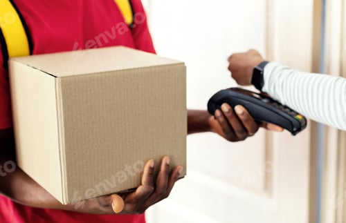 Preview: Lady Paying Courier For Parcel Delivery Using Smartwatch Indoor, Cropped