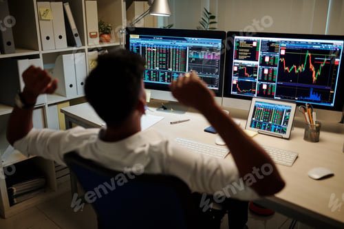 Preview: Trader stretching in chair