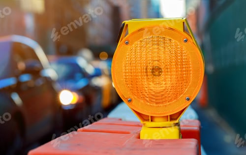Preview: Orange traffic barrier barrels to detour traffic around construction zone shallow depth
