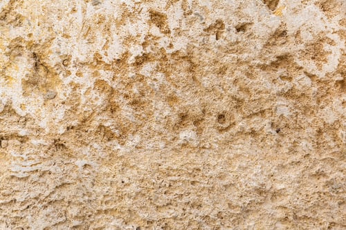 Preview: Worn stonewall background texture. Beige faded sandstone surface backdrop, empty, copy space.