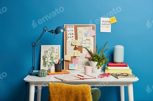 Preview: Creative workplace with no people, opened notepad, desk lamp, board with sticky notes to remember, i