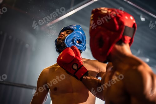 Preview: Two young professional boxer having a competition tournament on stage.