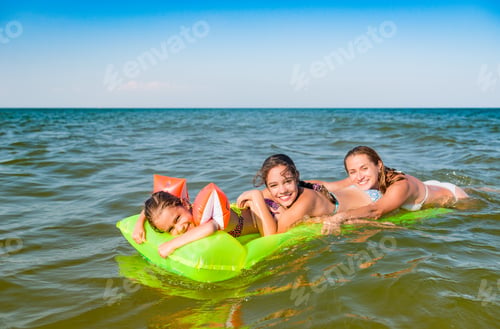 Preview: Happy mother and two small positive daughters