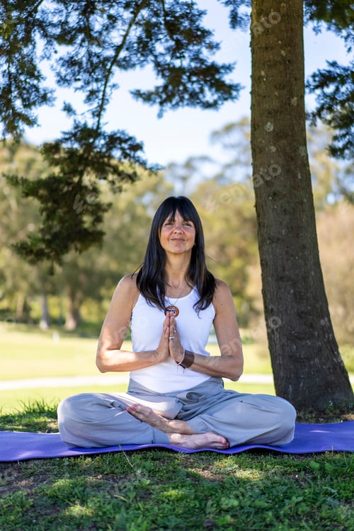 Preview: Mid-adult woman enjoying a tranquil moment of self-care and meditation