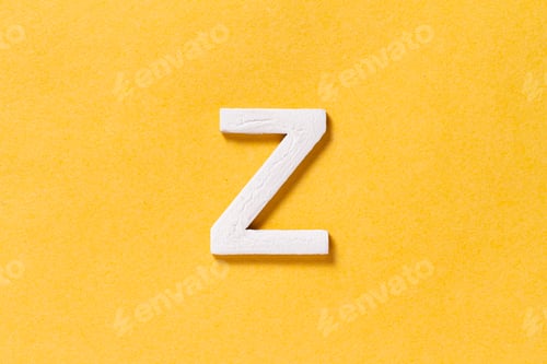 Preview: Letter Z of the alphabet isolated on yellow background, top view