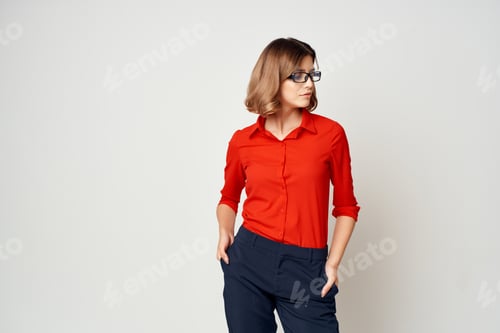 Preview: Stylish Woman in Red Shirt Posing Confidently