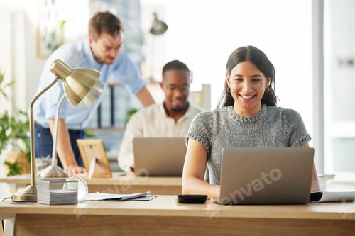 Preview: Shot of a group of young businesspeople working together in their office