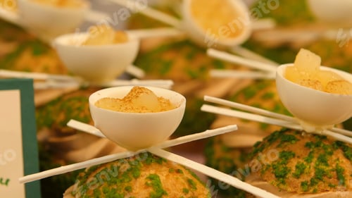 Preview: Carrot cake balls on kitchen table with marzipan. Many cakes are handmade from the creative pastry