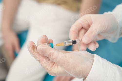 Preview: Nurse preparing vaccine for male patient in office
