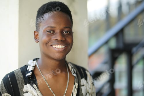 Preview: Young smiling attractive black man lifestyle portrait