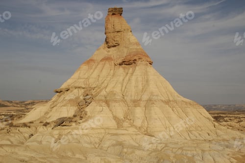 Preview: The Castildetierra of the Bardenas Reales in Navarra with clouds in the background. Spain