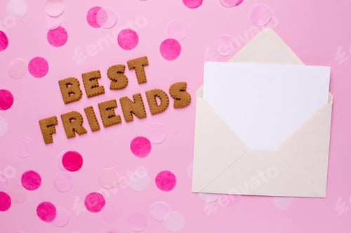 Preview: Letters cookies Best Friends with card and confetti on pink background