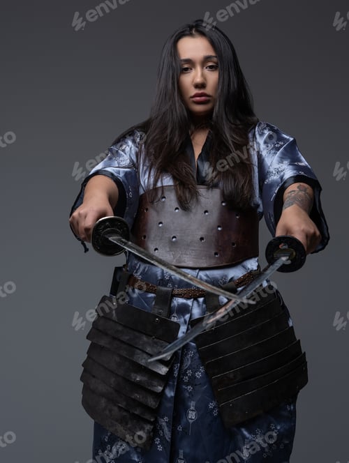 Preview: Asian woman samurai pointing katanas in front of her