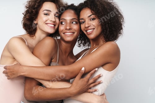 Preview: Portrait of charming multiethnic women smiling and hugging together