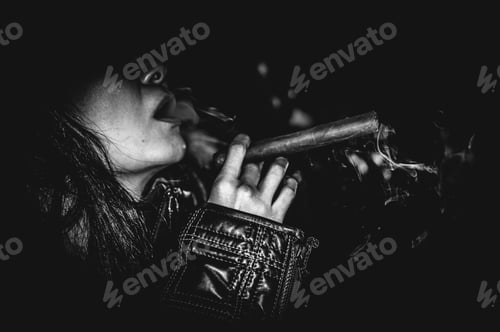 Preview: Girl smoking a cigar