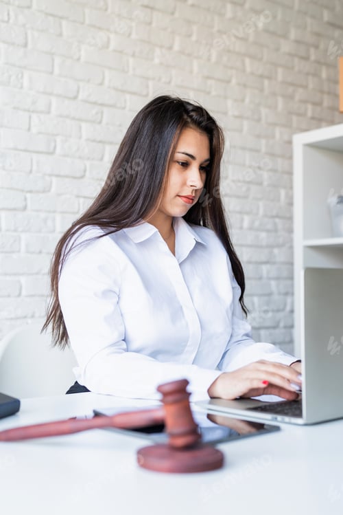 Preview: Portrait of young female lawyer at her workplace