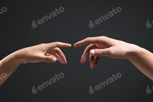 Preview: Human hands reaching for each other black background