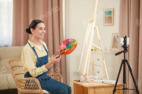 Preview: Teacher conducting online painting lesson at home. Time for hobby