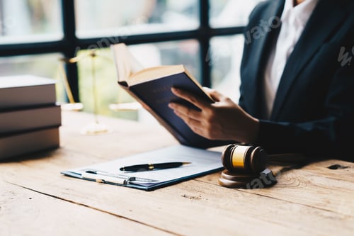 Preview: lawyer businessman working or reading law book in office workplace for consultant lawyer concept.