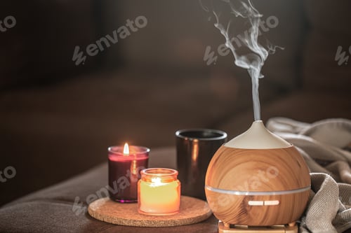 Preview: Modern oil aroma diffuser wiht decor details copy space.