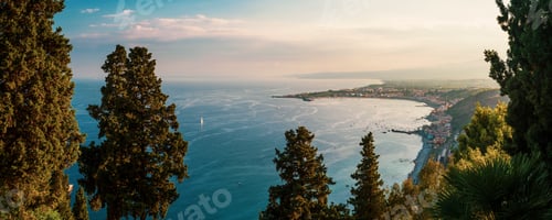 Preview: Taormina on the Sicilian Coast at sunset, panoramic photo of Naxos Bay, with the foot on Mount Etna