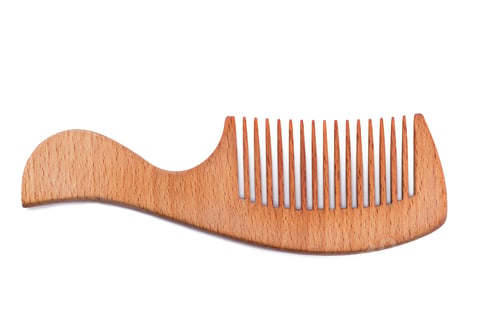 Preview: Wooden hair comb on white background.
