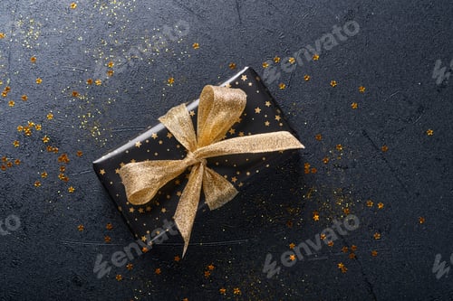Preview: Wrapped Gift with Gold Ribbon and Star Confetti