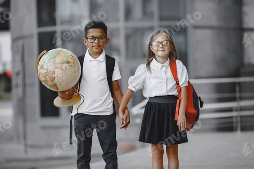 Preview: Little african boy study with caucasian girl