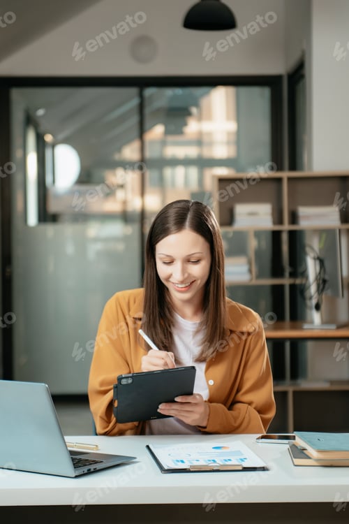 Preview: Business expert attractive smiling young woman typing laptop and holding digital tablet
