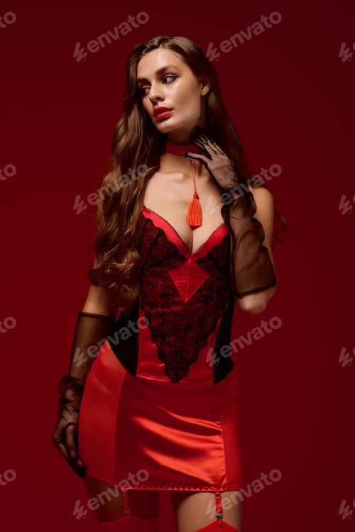 Preview: Seductive woman in alluring lingerie against a striking red backdrop for Valentines Day