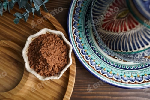 Preview: Cocoa powder in a clay bowl. Ingredients and spices for cooking