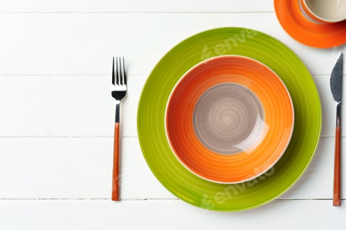 Preview: Top view of color ceramic plate on wooden background