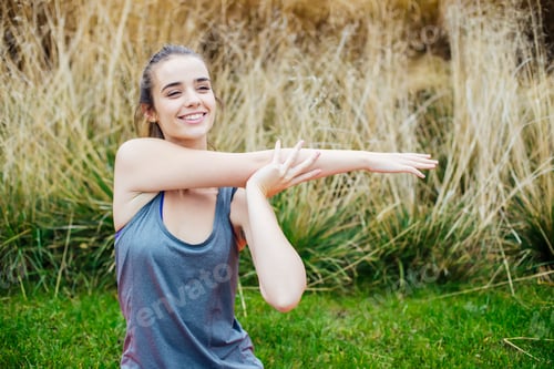 Preview: Young woman to practice stretching after yoga on mat outdoor