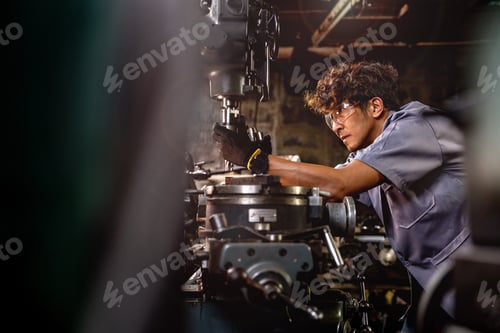 Preview: Men are inspecting steel parts for machine installation.