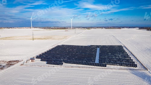 Preview: Alternative energy in Poland. Snowy photovoltaic farm in winter.