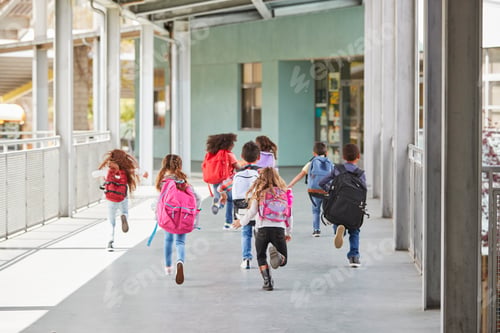 Preview: Elementary school kids run from camera in school corridor