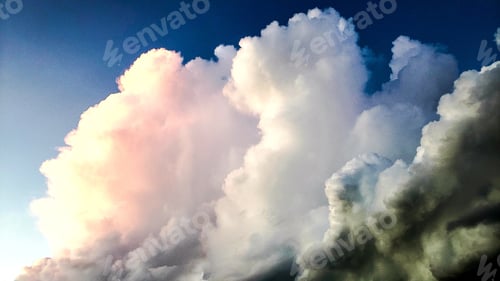 Preview: Beauty in nature at morning sunrise over ocean with blue sky and colorful clouds.