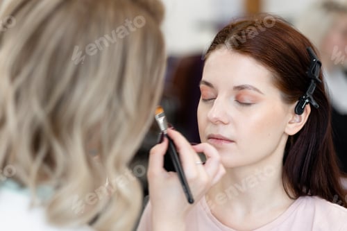 Preview: Professional make-up master class. Young beautiful model, make up in process
