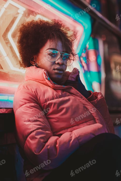 Preview: Black woman standing on night city street