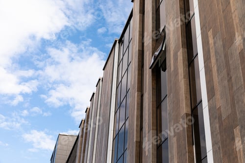 Preview: Tall office building on sky background