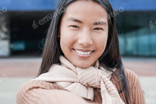 Preview: Young asian girl taking a selfie outdoor