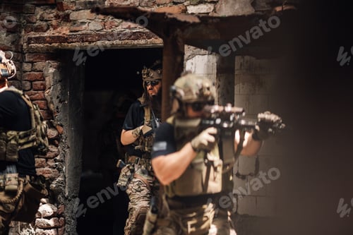 Preview: Group of air soft players in formation attacking enemy's base.