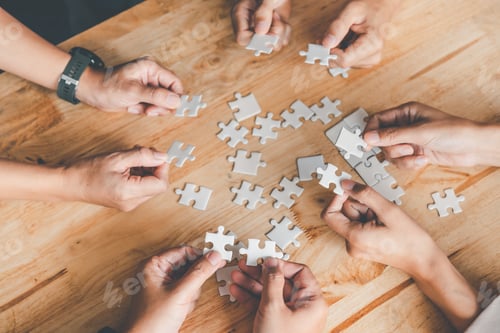 Preview: Business team handle a piece of white puzzles that are about to drop to get a complete worksheet