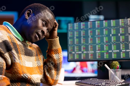 Preview: Tired financial advisor works on revenue balance with annual statistics