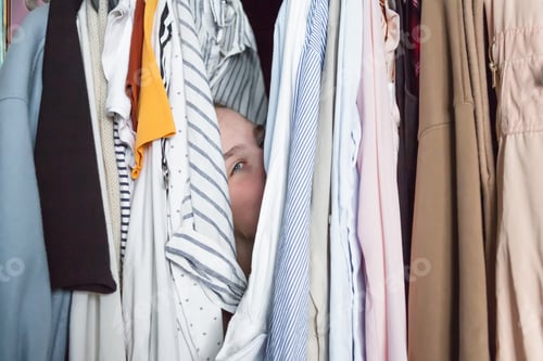 Preview: Spring cleaning,Fast fashion, the girl puts things in order in the closet. A bunch of colorful