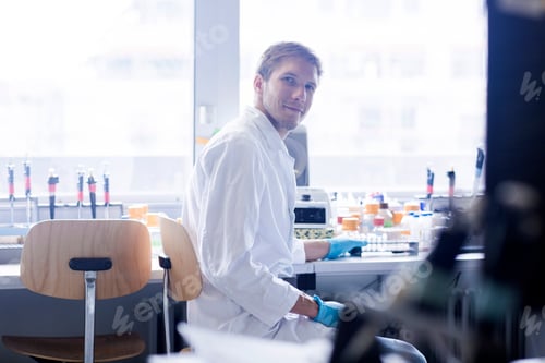 Preview: Portrait of young male scientist at lab bench