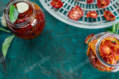 Preview: Homemade sun dried tomatoes with herbs, garlic in olive oil in a glass jar