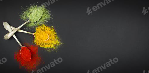 Preview: Types of various spices in spoons on a dark table. Spices for food. Food background.Copy space.